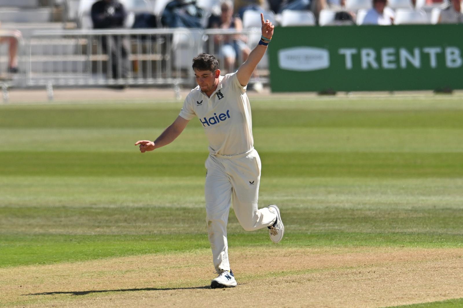 Ethan Bamber of Warwickshire celebrates taking a wicket during the Rothesay County Championship One match between Nottinghamshire County Cricket Club and Warwickshire County Cricket Club at Trent Bridge, Nottingham, UK on 25 April 2026.